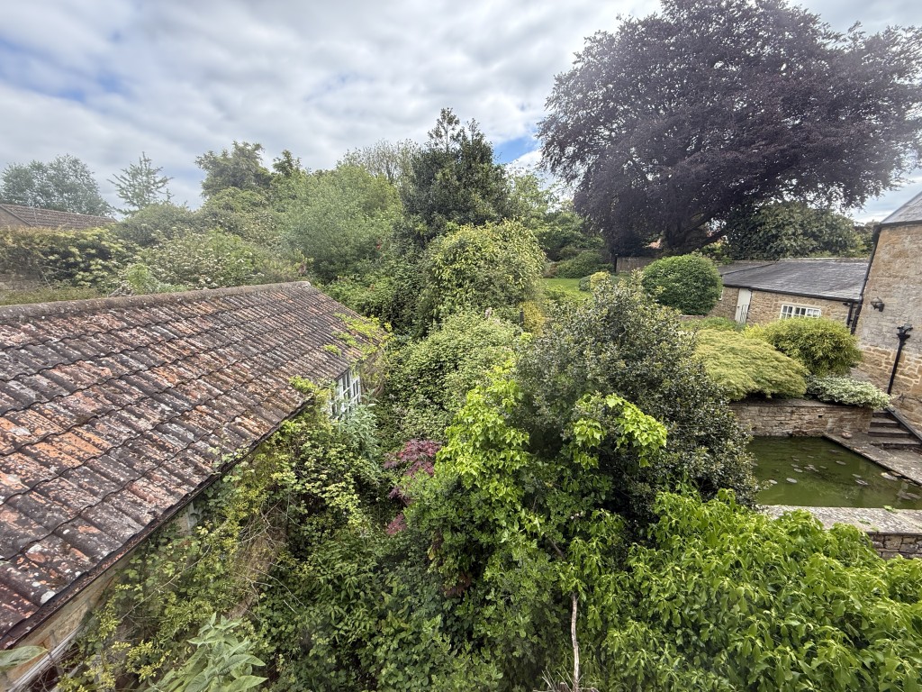 Lot: 99 - CHARACTER SEMI-DETACHED COTTAGE FOR UPDATING WITH LARGE GARDENS - View of garden from first floor